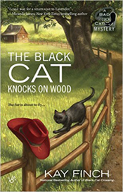 the black cat knocks on wood